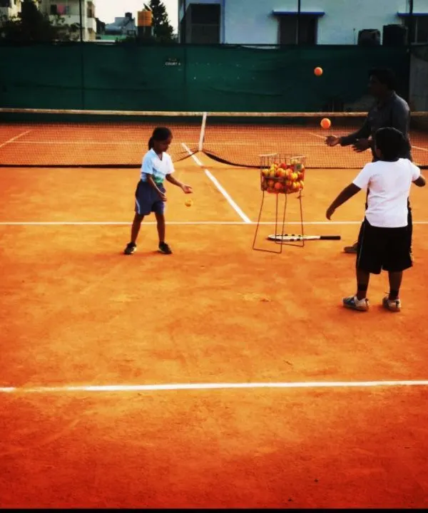 Young beginners practice hand-eye coordination, a core skill for starting tennis. These fun drills are designed to make learning the basics engaging and effective.