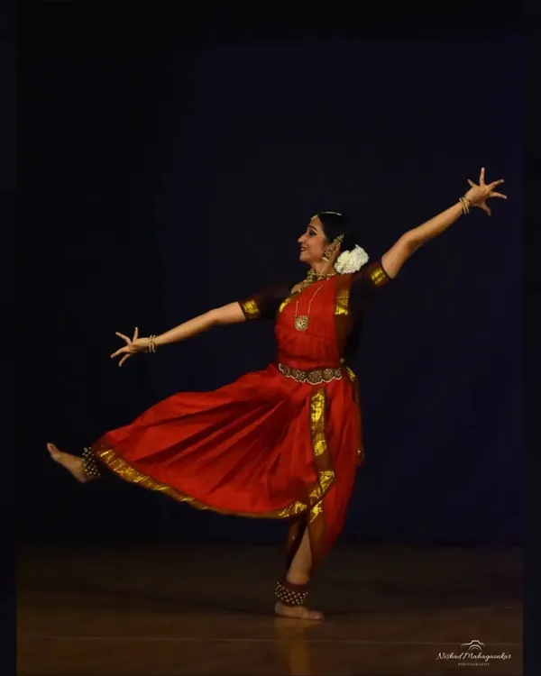A classic Bharatanatyam pose from a solo recital in Pune. This posture, with its clean lines and expansive energy, is a fundamental element of the nritta or pure dance aspect of my performances.