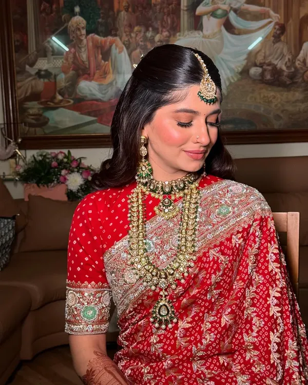A beautiful close-up of a bride's soft and radiant makeup. The look features defined eyes, a natural glowing base, and a neutral lip color, perfect for a traditional wedding ceremony.