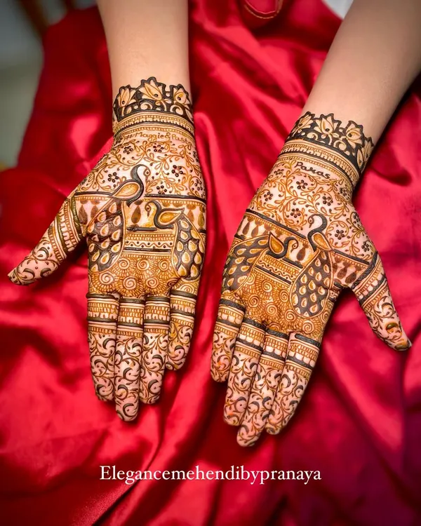 An elegant design focusing on my signature peacocks, with intricate feathers and details that fill the hands.