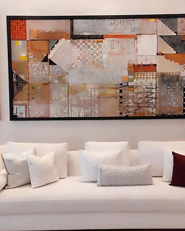 Timeless in white, this sofa embodies quiet luxury and tranquility. Paired with a curated selection of our textured white and deep burgundy cushions, it becomes the serene centerpiece of a sophisticated living space, anchored by compelling modern art.