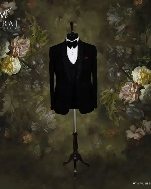 This black velvet tuxedo is the epitome of classic sophistication. I crafted it with self-embossed designs and delicate hand embellishments on the lapel for a subtle yet luxurious finish.