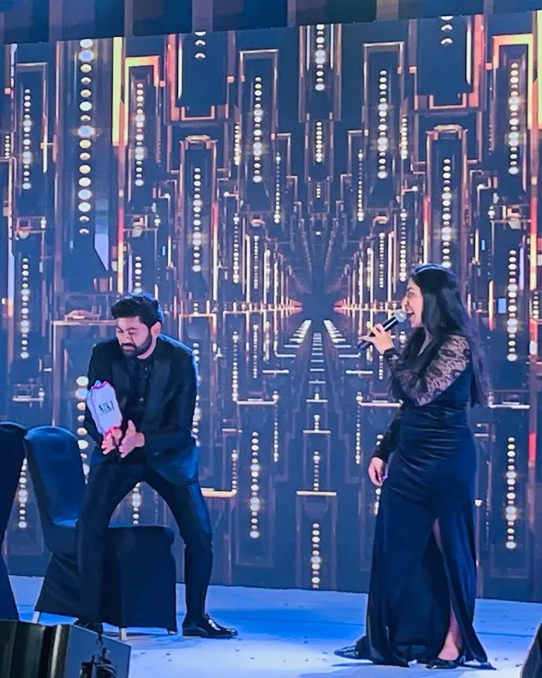 On stage during a Sangeet, engaging with the groom and getting the crowd laughing. My role as an entertainer is to create these spontaneous, fun-filled interactions that become the highlights of the evening.