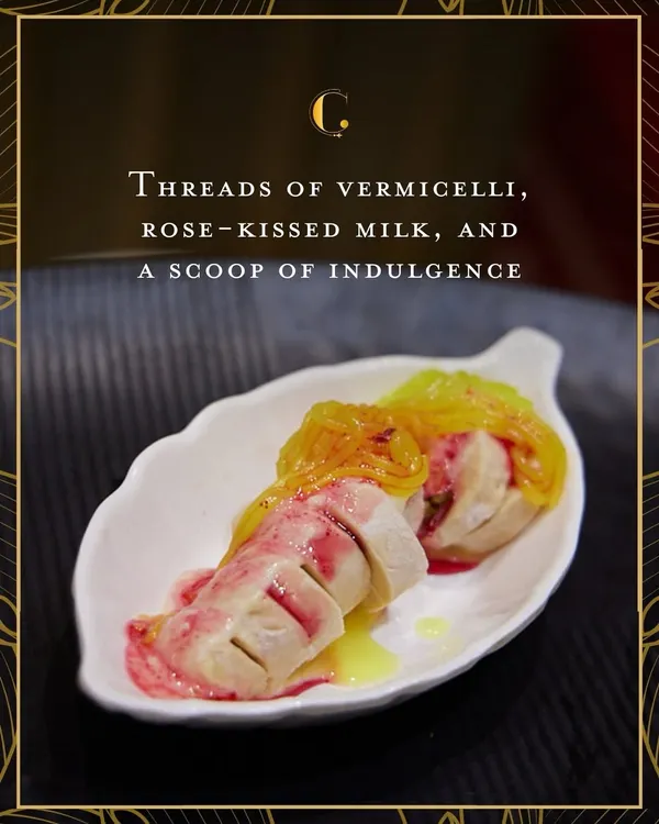 A deconstructed falooda, elegantly plated. This dessert features threads of vermicelli, rose-infused milk, and a scoop of rich kulfi, creating a beautiful symphony of textures and festive flavours.