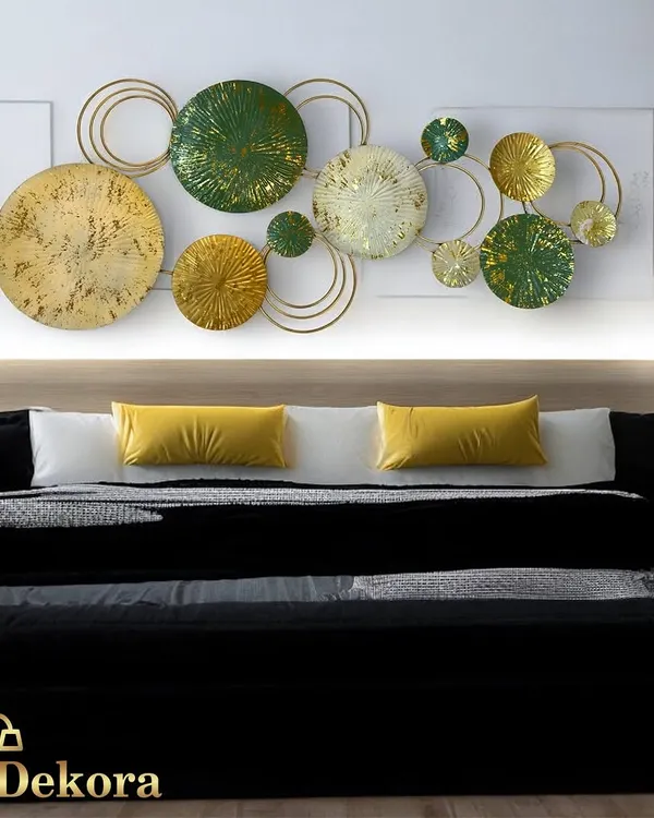 A closer look at our popular green and gold abstract wall sculpture. The varying sizes and textures of the discs, combined with open wire rings, create a dynamic and visually engaging piece.
