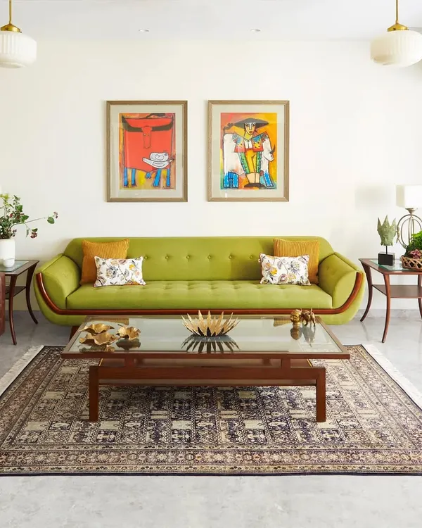 This living room is one of my favorite projects, where vibrant colors and vintage-inspired furniture come together. The green sofa, bold artwork, and classic Indian rug create a space that is full of personality and warmth.