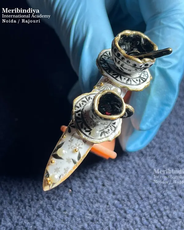 This is the level of artistry you can achieve. We teach advanced 3D nail sculpting, allowing you to create miniature masterpieces like this royal teacup design, complete with intricate hand-painted details and gold accents.