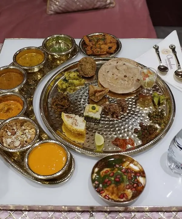 The centerpiece of our Rajasthani sit-down experience. This authentic thali is a feast of flavors, featuring dal, bati, churma, gatte ki sabzi, and more.