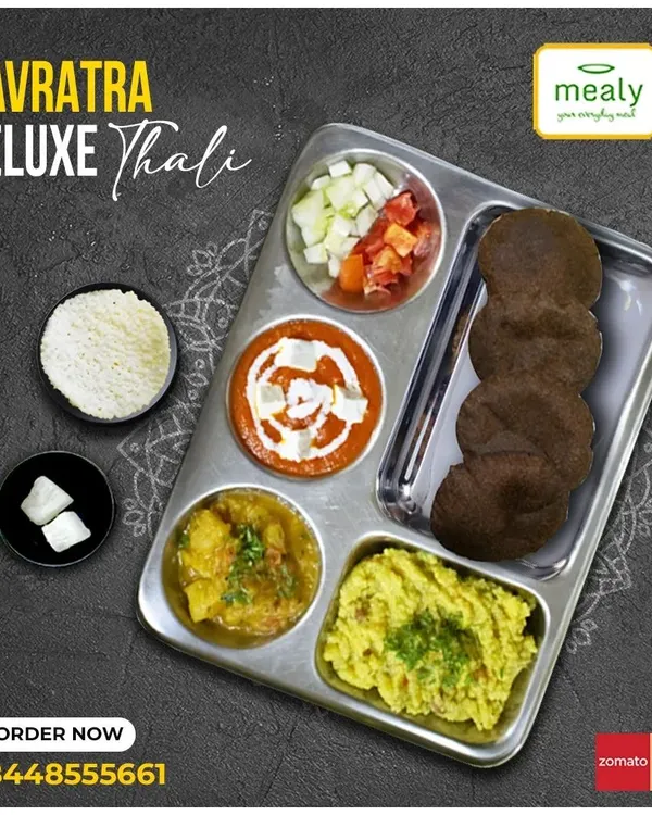 A complete Navratra Deluxe Thali, prepared for your fast. This meal includes Samak Rice Khichdi, Paneer ki Sabzi, Aloo ki Sabzi, and Kuttu ki Puri, all cooked with sendha namak and no onion or garlic.