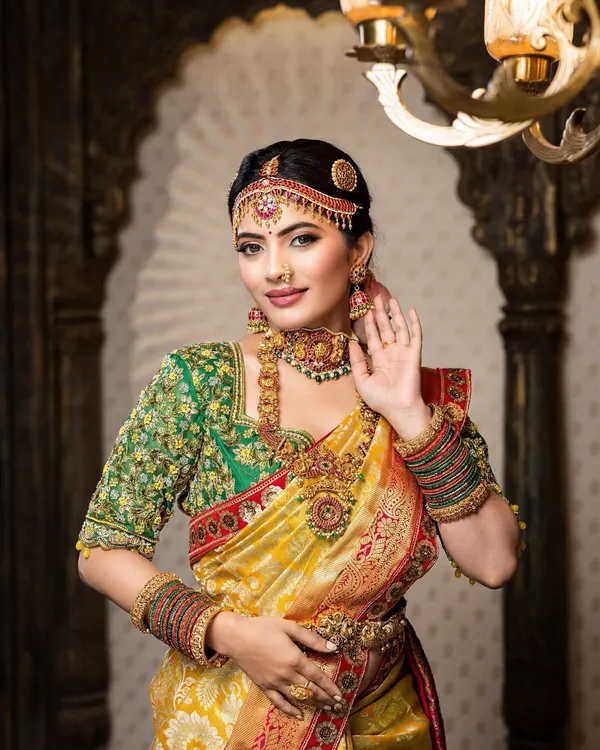 This is the quintessential South Indian bridal look I love to create. The focus is on radiant skin, bold eyes defined with classic liner, and a lip color that complements the rich Kanjivaram saree, making you feel like royalty on your Muhurtham.