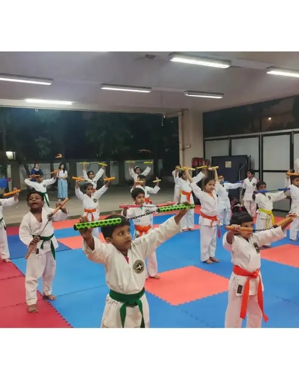 Students practicing with Nunchaku, a traditional martial arts weapon. Weapon training improves coordination, focus, and provides an advanced skill set.