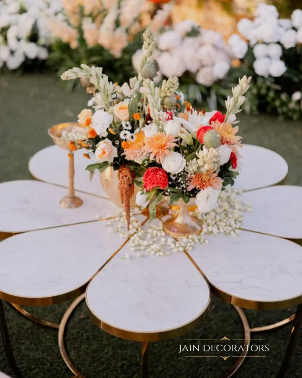 A centerpiece that is a work of art. I designed this flower-shaped marble table and topped it with a vibrant floral arrangement, creating a detail that is both unique and incredibly chic.
