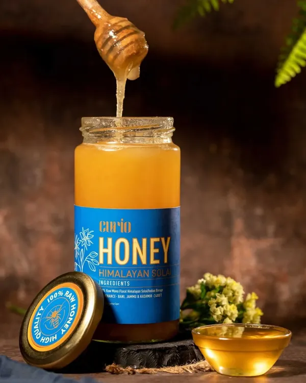 Action shots bring a product to life. Capturing this thick, golden honey as it drips from the dipper creates a dynamic and mouth-watering image that communicates the product's quality and natural texture.