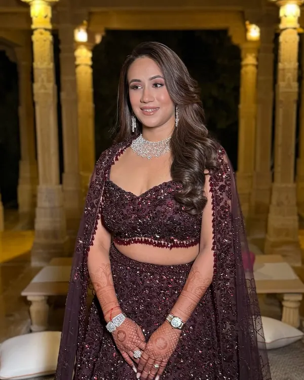 This bride's impeccable skin deserved a glow to match for her reception. I created a sophisticated look with a soft smokey eye and a nude lip to complement her stunning jewel-toned Seema Gujral design.