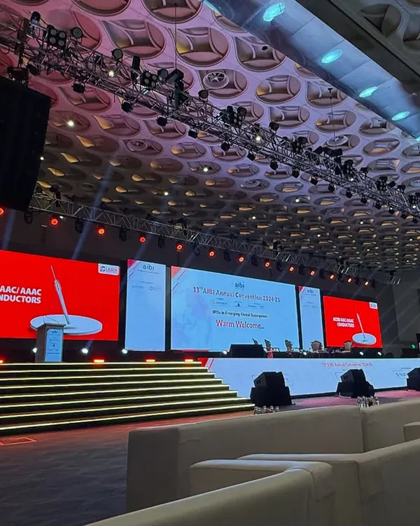 A wide view of our setup for the AIBI Annual Convention. This showcases the large-scale lighting rig, speaker systems, and expansive stage designed to accommodate panel discussions and keynote speakers in a grand hall setting.