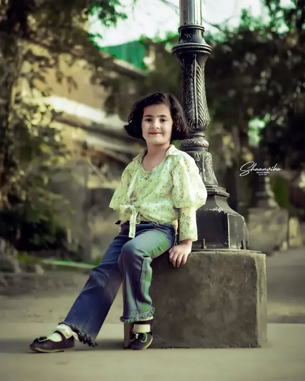 My daughter posing like a little model by a vintage lamp post. This kids portrait session was all about having fun and letting her personality come through.