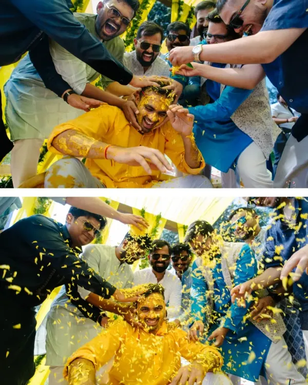 The groom is playfully covered in turmeric and flower petals by his friends. This is the kind of joyful chaos I love to capture during a Haldi ceremony.