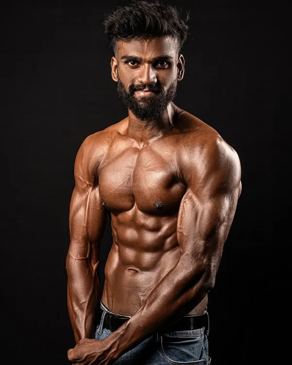 A professional shot of my client after his transformation. The confidence he gained is just as important as the muscle he built.