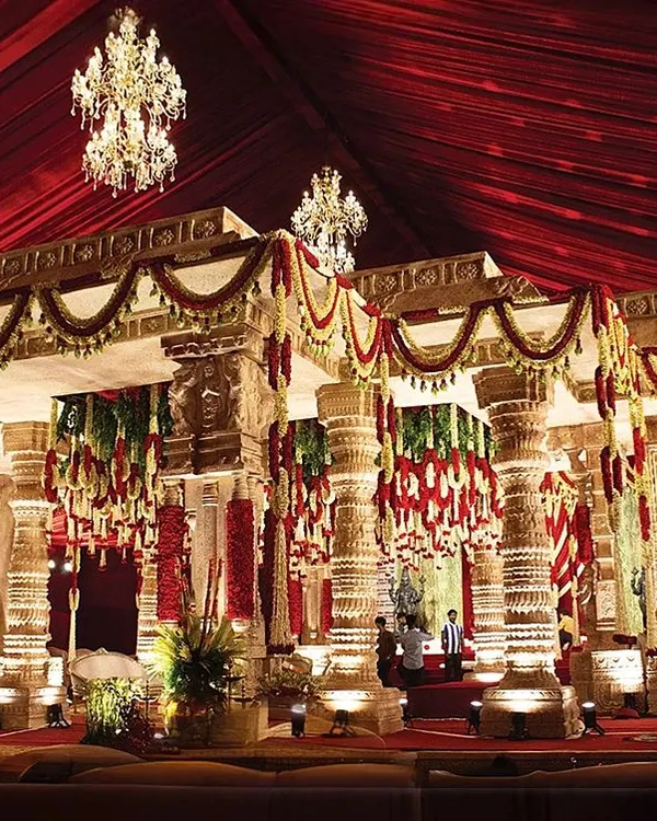 The pillars of this mandap are directly inspired by the famed musical pillars of Hampi. We crafted each one to echo the harmony of ancient art, creating a stunning fusion of cultural heritage and luxurious design for a sacred ceremony.