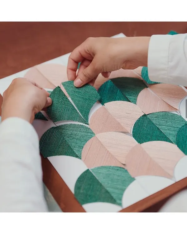 Craftsmanship and excellence are at the heart of what I do. This behind-the-scenes snapshot shows a wallpaper in the making, where each piece is hand-assembled. I source from artisans who treat every wallcovering as a work of art.