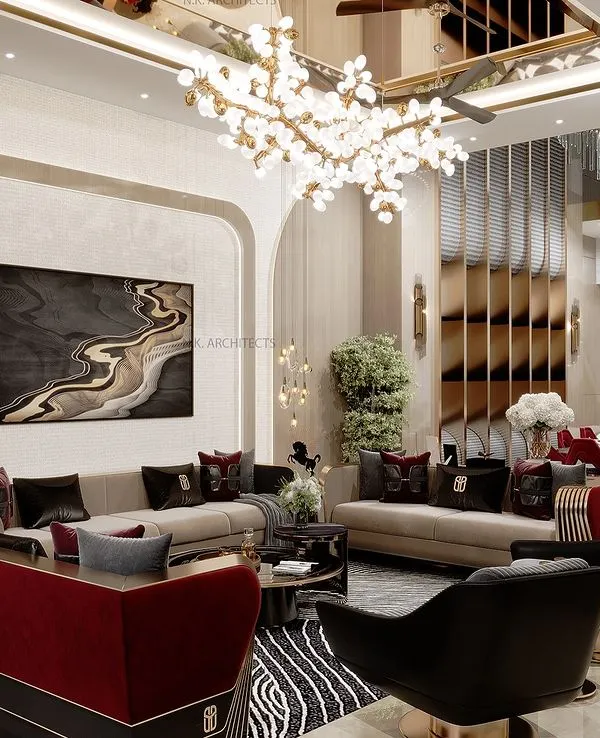 This double-height living room is designed for luxurious events and comfortable family moments. The design features a dramatic art piece, a mix of bold red and neutral tones, and a stunning chandelier to create a grand yet inviting atmosphere.