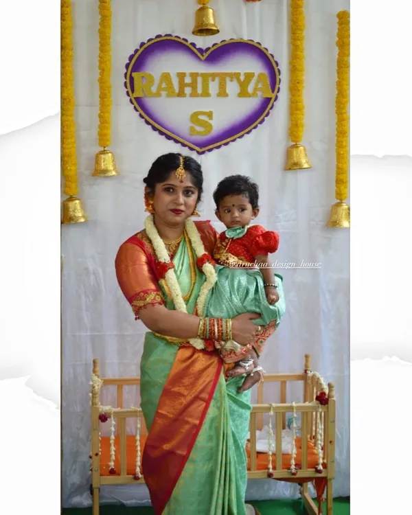A heartwarming moment with a mother and daughter duo in their matching outfits for a naming ceremony. I designed a simple, elegant saree and blouse for mom, with a cute matching dress for her baby.