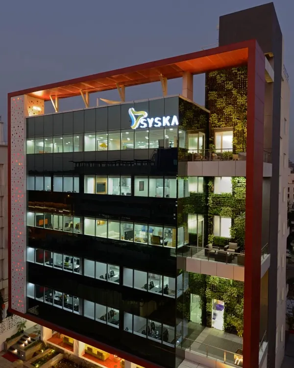 Our design for the Syska corporate headquarters in Pune features a prominent multi-story vertical garden on its facade. This was a pioneering use of biophilia in corporate architecture, creating a living, breathing building.
