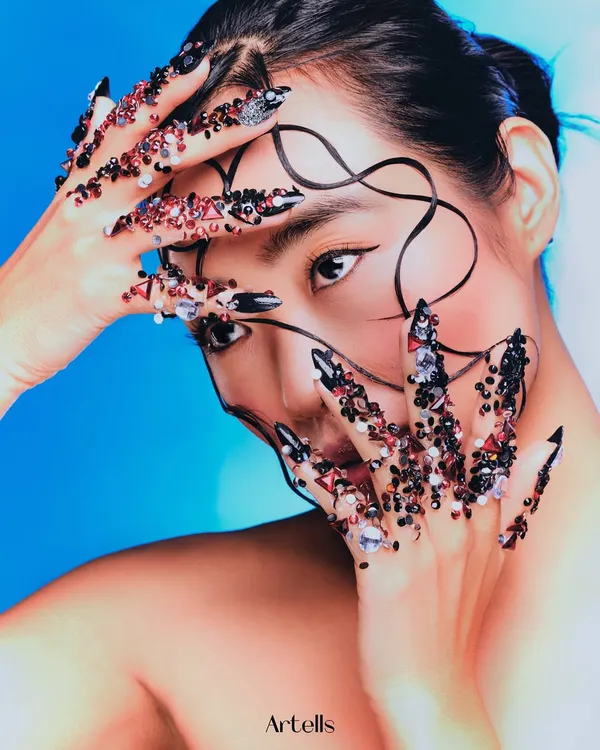 A symphony of texture and light. For this "Seraphine" editorial, I designed intricate, jeweled nails and a wet-look, sculpted hairstyle to create a high-fashion, avant-garde narrative.