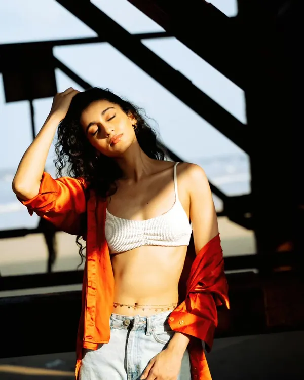 Capturing that perfect sun-kissed moment. The play of light and shadow under this old Mumbai pier created a naturally beautiful frame for this portrait.