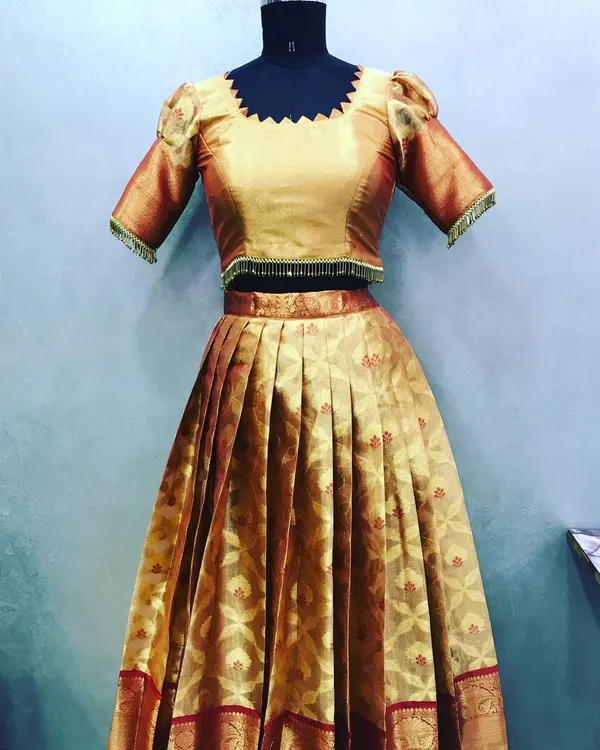 This entire lehenga and blouse set was stitched from a single silk saree. I used the body of the saree for the pleated skirt and the pallu for the puff-sleeve blouse.