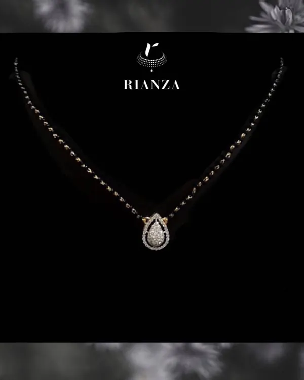 An elegant and modern mangalsutra featuring a pear-shaped diamond pendant. This design is a statement of style that a modern married woman can flaunt every day.