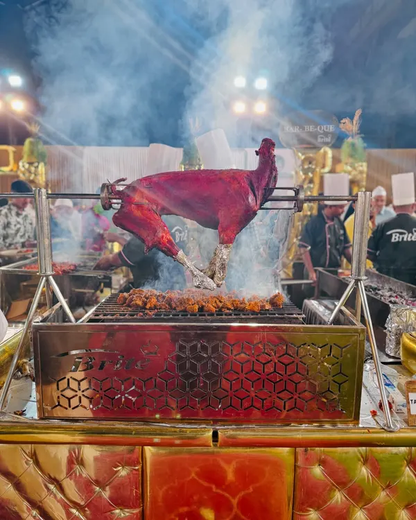 The centerpiece of our live barbecue station, a whole tandoori-spiced goat slow-roasting over charcoal. The sight and smoky aroma create an interactive and theatrical dining experience that guests talk about long after the event.