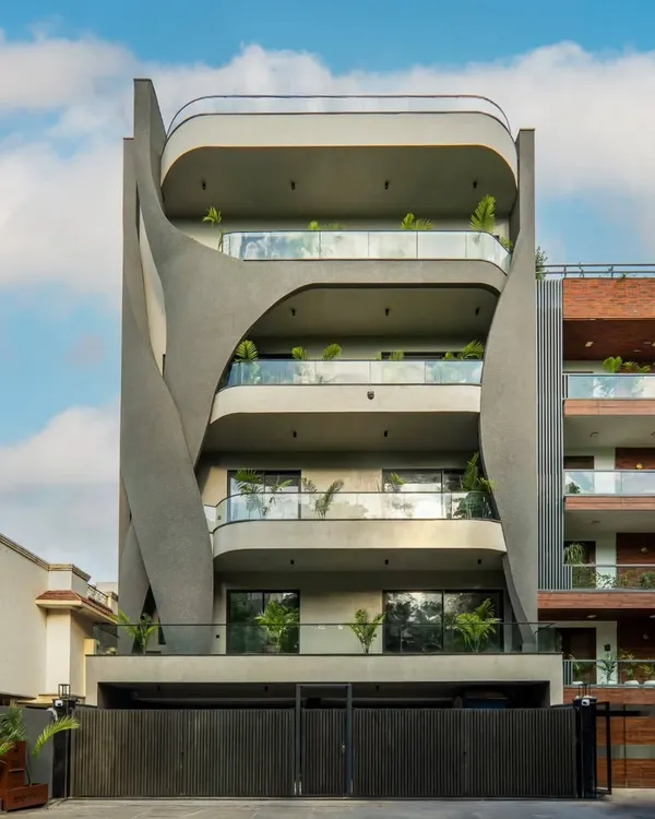 Presenting Lotus Villa, a sculptural facade that speaks the language of fluid architecture. Designed with sweeping concrete forms and full-glass balconies, the facade mimics natural movement while maintaining a strong urban character.