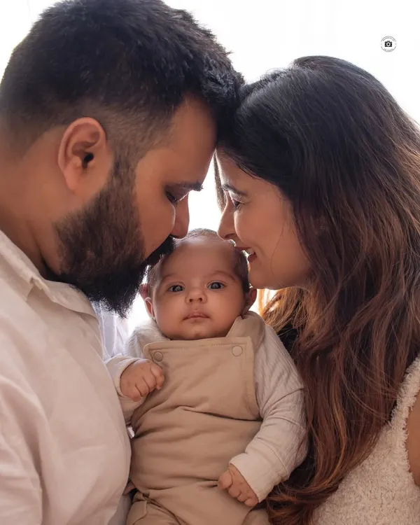 A quiet moment between new parents and their baby. These close-up, intimate family portraits are some of my favorites to capture.