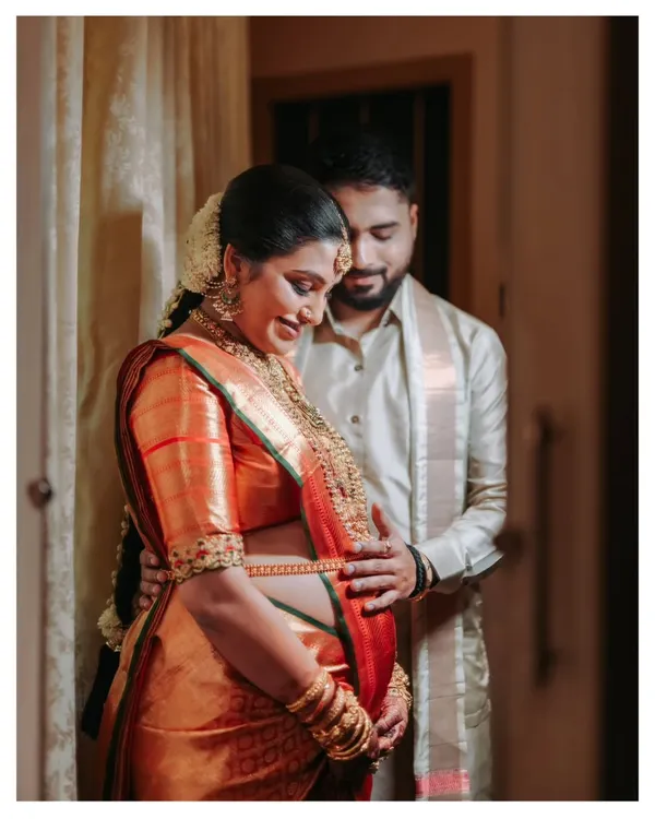 A quiet moment of connection before the little one arrives. I focus on capturing this gentle anticipation, using warm, natural light to highlight the bond between partners during an indoor maternity portrait session.