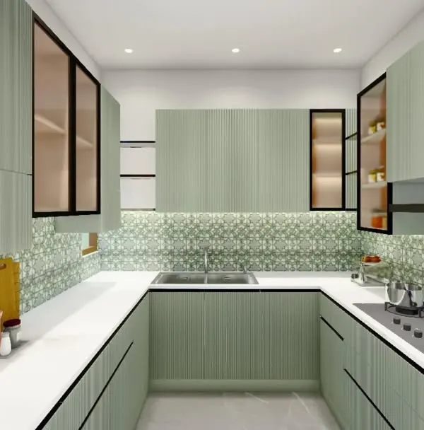 This U-shaped kitchen layout maximizes counter space and storage, making it highly functional for avid cooks. The sea-green fluted cabinets are paired with a patterned backsplash and under-cabinet lighting for a bright and efficient workspace.