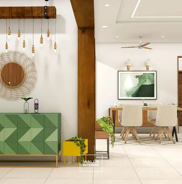 A vibrant green sideboard with a geometric chevron pattern on the doors. Paired with a rustic wooden beam light fixture, this piece makes a bold statement in the dining area.