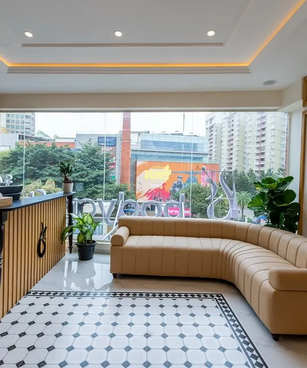 A look at our bright and modern Yelahanka clinic reception. We've created a welcoming space with a comfortable lounge area, ensuring your wellness journey begins the moment you step inside.