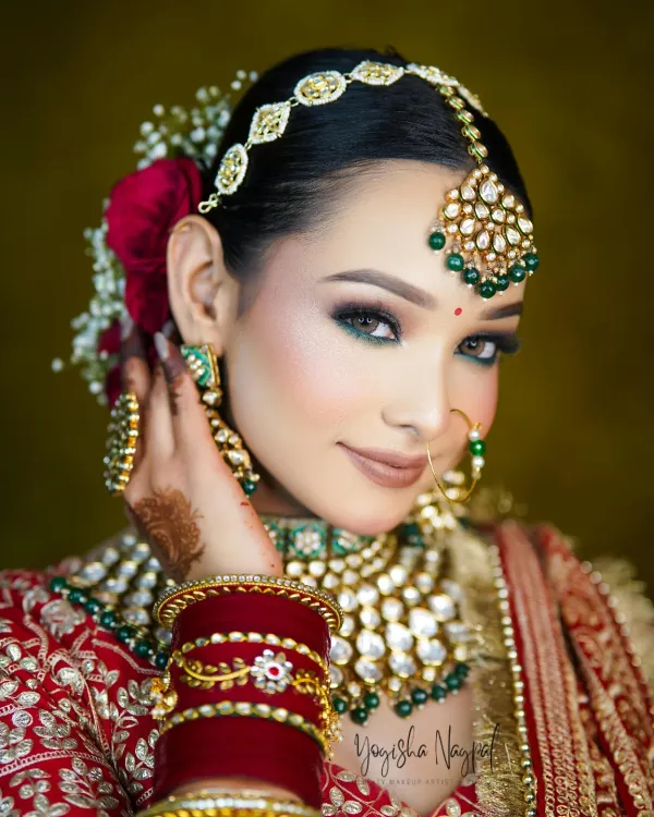 This is the look every bride dreams of. I focused on creating striking green smokey eyes that complement the traditional jewelry, paired with a flawless, radiant skin finish. This HD makeup is designed to be long-lasting and look perfect both in person and on camera.