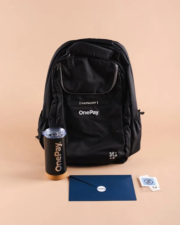 A complete new joinee kit we curated for OnePay. This onboarding gift includes a branded backpack, a sleek tumbler, a welcome letter, and stickers to make their first day memorable.