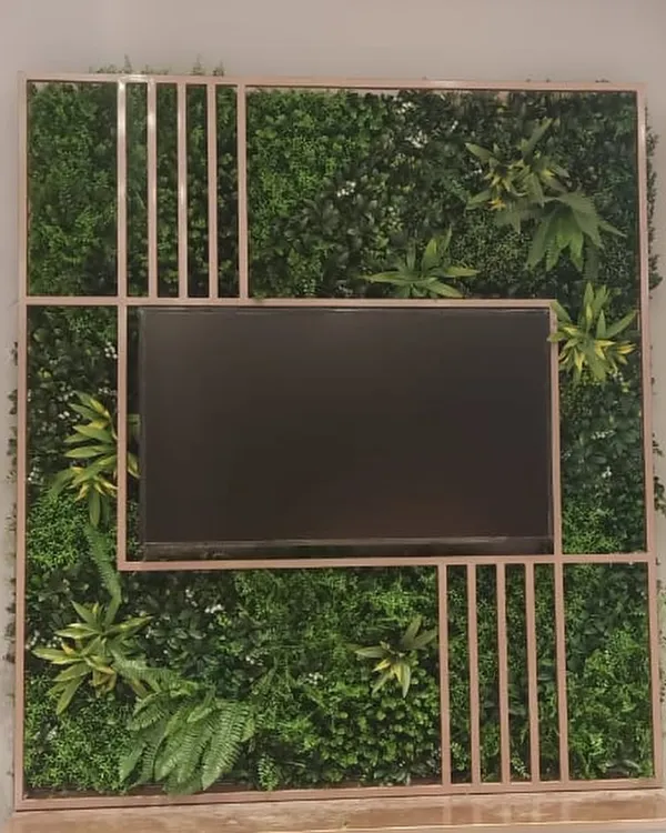 For the Biba showroom in Salem, I designed and installed this artificial green wall as a backdrop for a media screen, bringing a touch of nature into a commercial retail space.