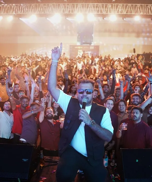 The view from the stage at 'The Next Orbit' for MakeMyTrip. An incredible sea of people, hands in the air, completely lost in the music. This is what a successful corporate party looks like.