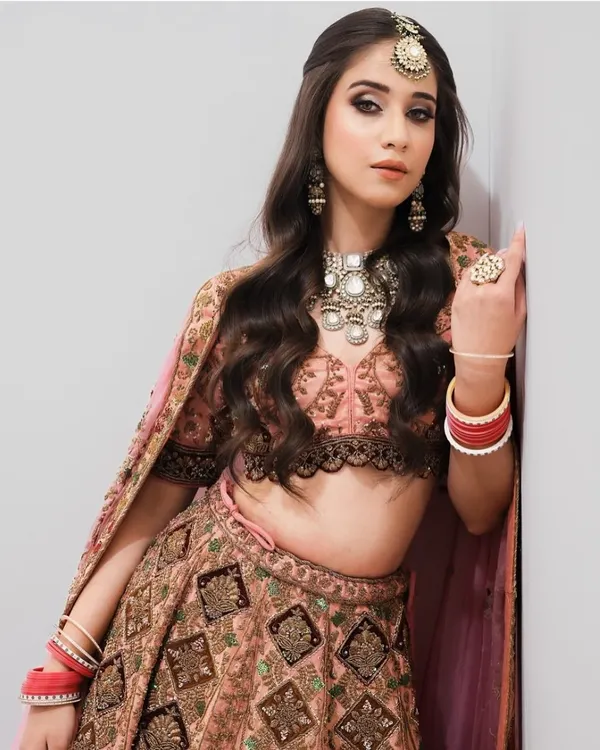 A modern bridal look featuring soft waves and a subtle smokey eye, perfect for pre-wedding functions. Our courses teach you to create versatile looks for every ceremony.