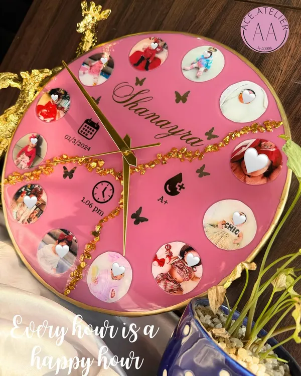 Celebrate every precious moment with a custom baby clock. This bright pink resin clock features twelve photos from baby Shanayra's first year, along with her birth details, making it a perfect centerpiece for a nursery.