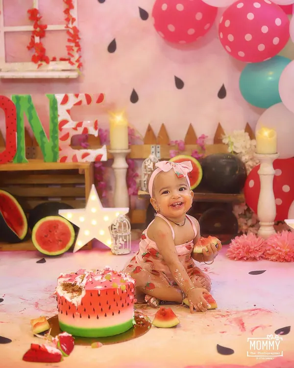 This is what pure joy looks like! This little one is having the best time during her "One in a Melon" themed cake smash, and her happy smile says it all. ✨