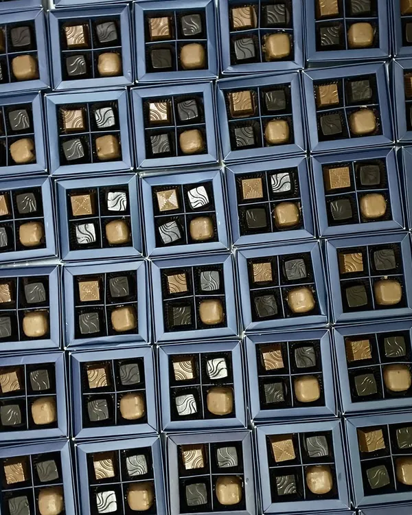 Gifting never tasted so divine. A large order of our four-piece artisanal chocolate boxes, ready for a corporate event or as wedding favors.