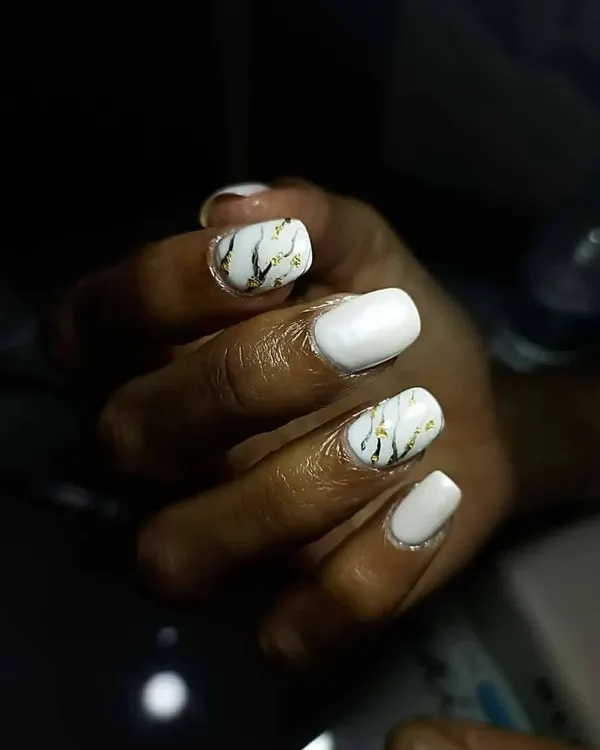 I love creating these uber classy and chic marble nails. This design features white marble with black and gold veins for a sophisticated, stone-like effect.
