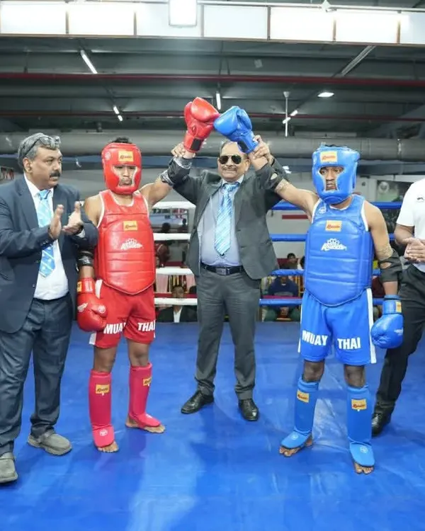 A proud moment at the 4th National Muay Thai Championship. The referee raises my student's hand in victory, a reward for all the hard work and dedication in the gym.