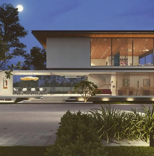 This 3D visualization captures a modern clubhouse design at night, where extensive glass walls blur the line between the interior and the surrounding landscape. The strategic exterior lighting highlights both the architectural form and the carefully selected plantings, creating an inviting and sophisticated community hub.