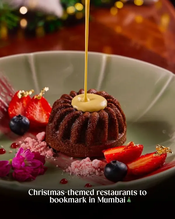 A stunning Christmas themed dessert. The sauce pour adds action, while the festive plating with berries and gold leaf makes it look like a special holiday treat. This is a perfect hero shot for a restaurant's Christmas menu.